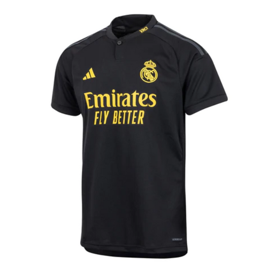Camiseta Real Madrid tercera 2023/2024 vista sobre fondo blanco