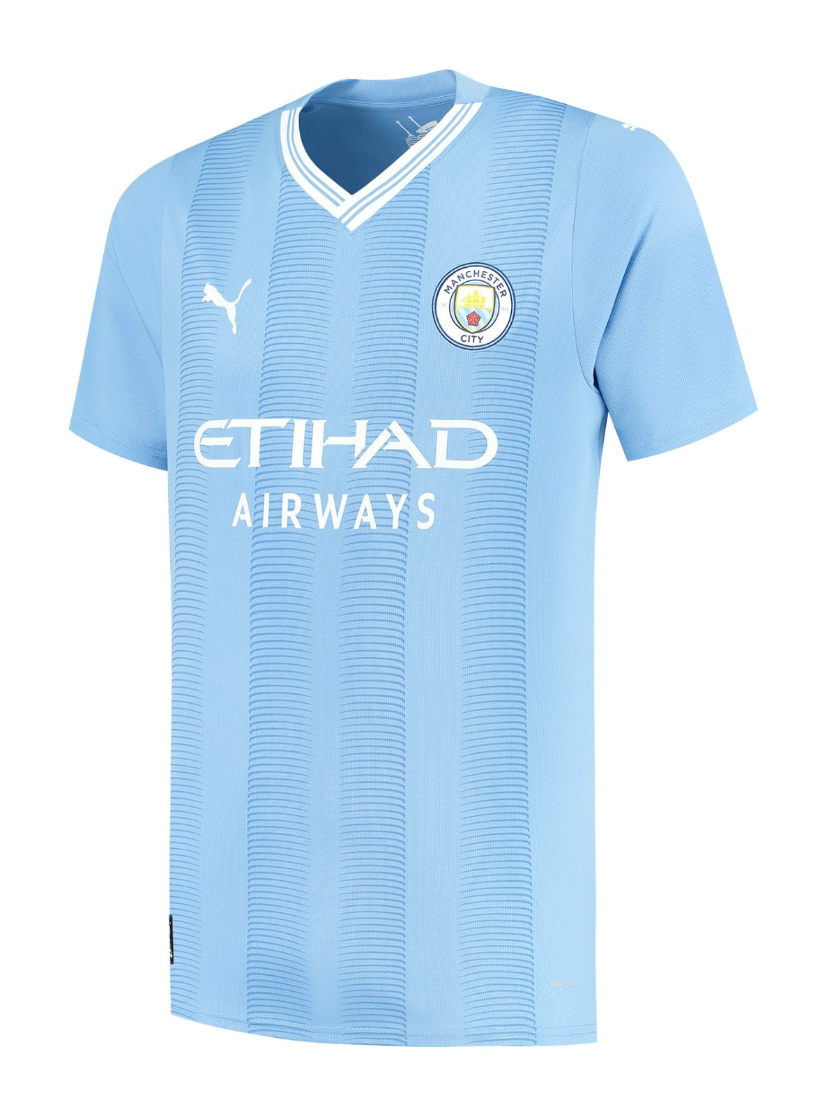 Camiseta Manchester City local 2023/2024 - Versión Jugador vista sobre fondo blanco