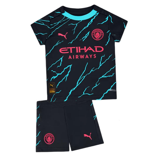 Camiseta + short Manchester City tercera 2023/2024 - NIÑOS vista sobre fondo blanco
